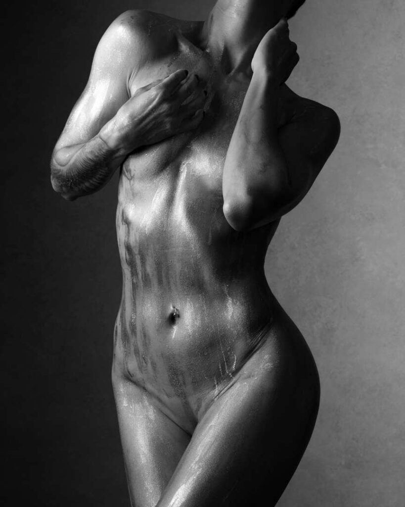 Close-up of nude torso, light shaping form like terrain