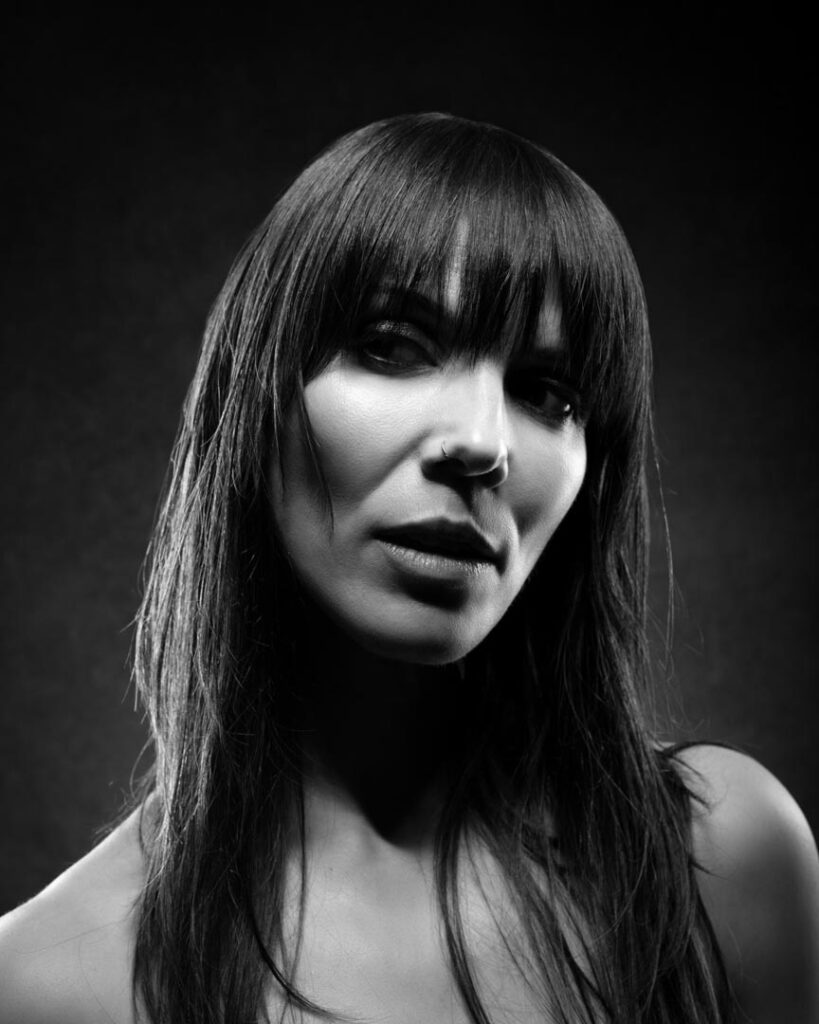 Fine art portrait photographer working with light and form